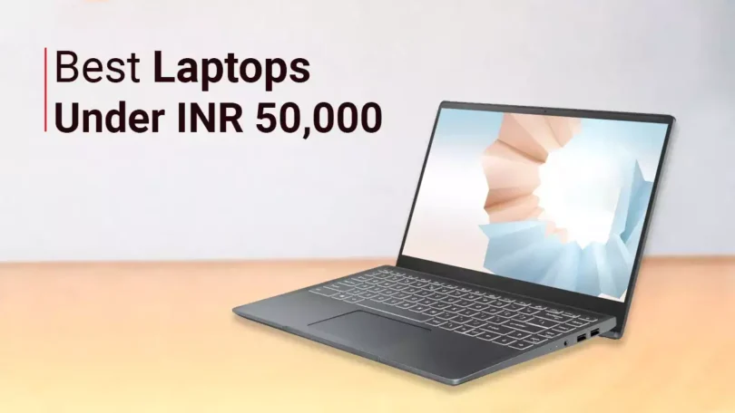 "A premium modern laptop on a wooden office desk displaying a colorful Windows desktop, notebook, coffee cup, wireless mouse, minimal workspace, realistic lighting, ultra-detailed, 8K professional technology photography."